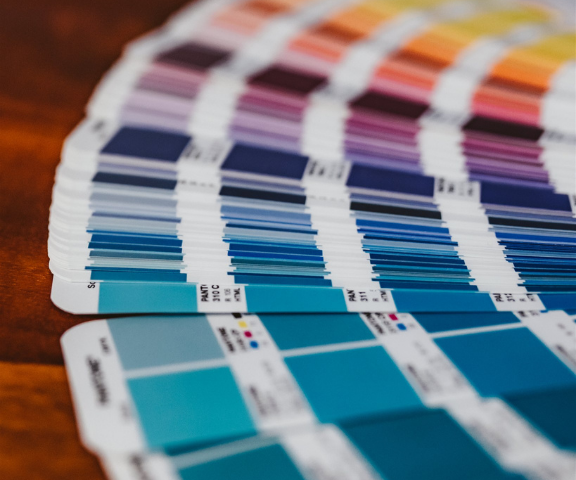 Attract clients with color pantone color swatches open on desk