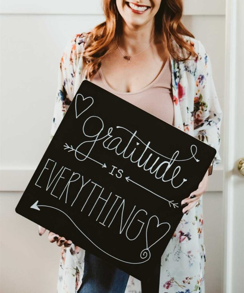 Heather Piazza holding gratitude is everything sign